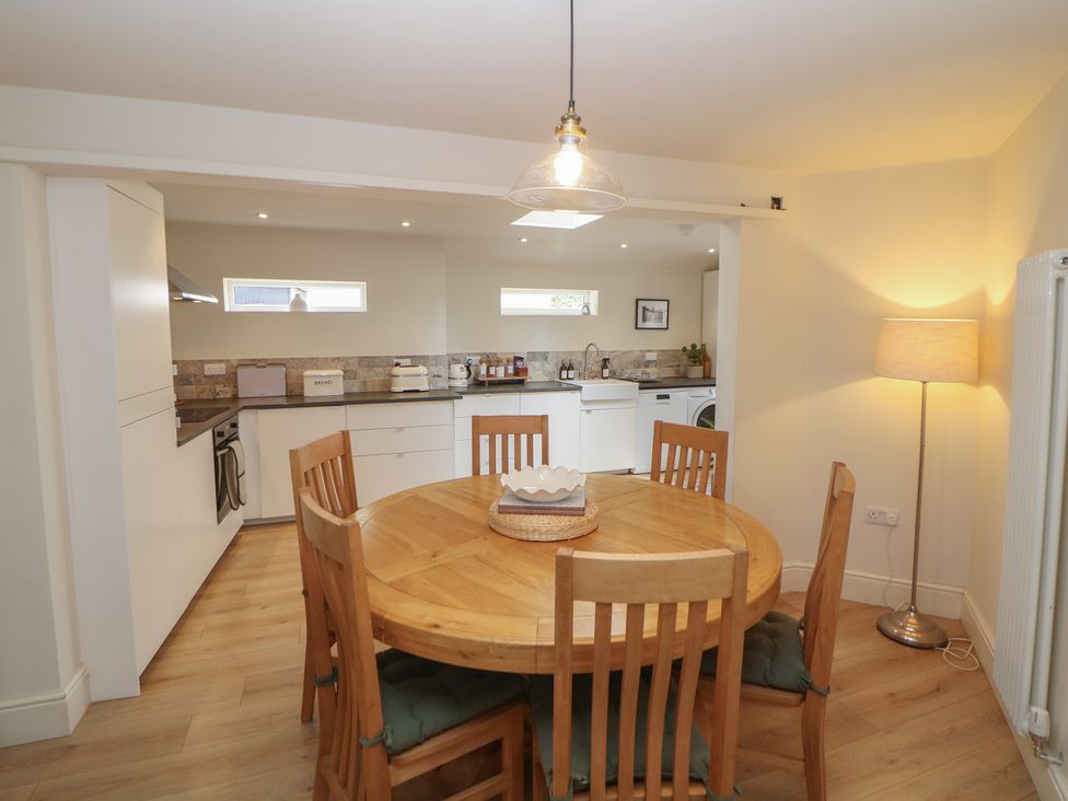 A kitchen with a dining table and chairs at Lion House in Ashbourne