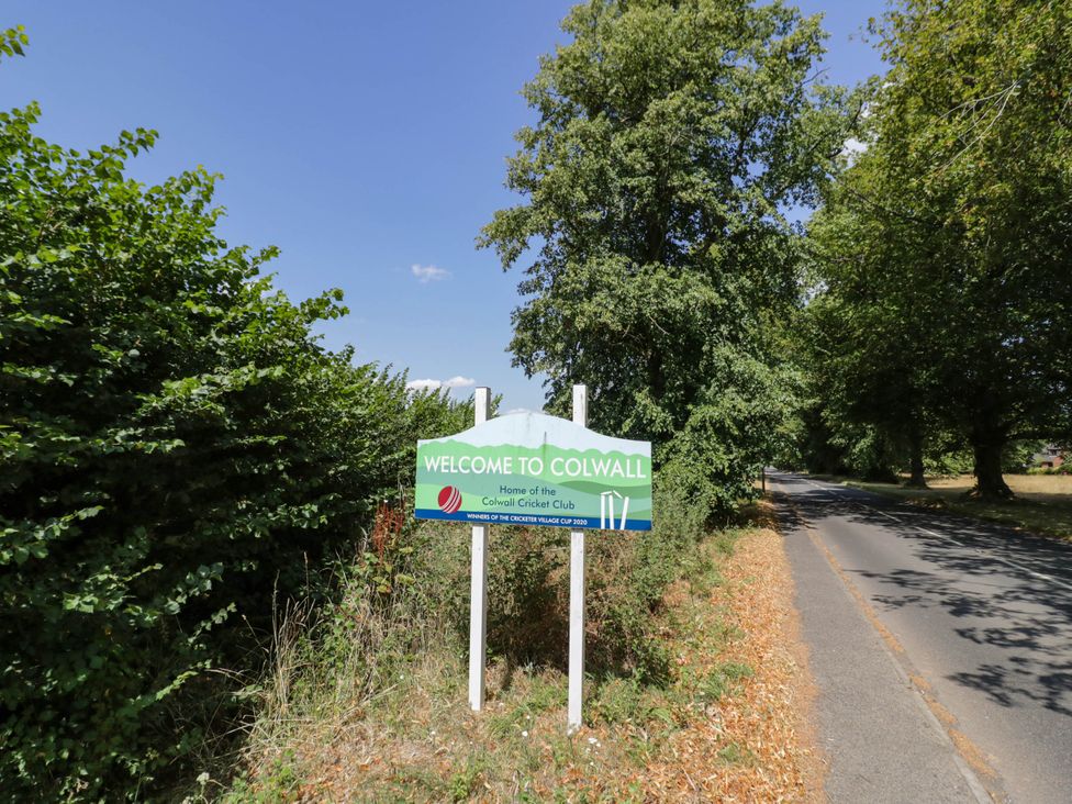 A welcome sign for Colwall as seen from the road in Colwall Green near Great Malvern