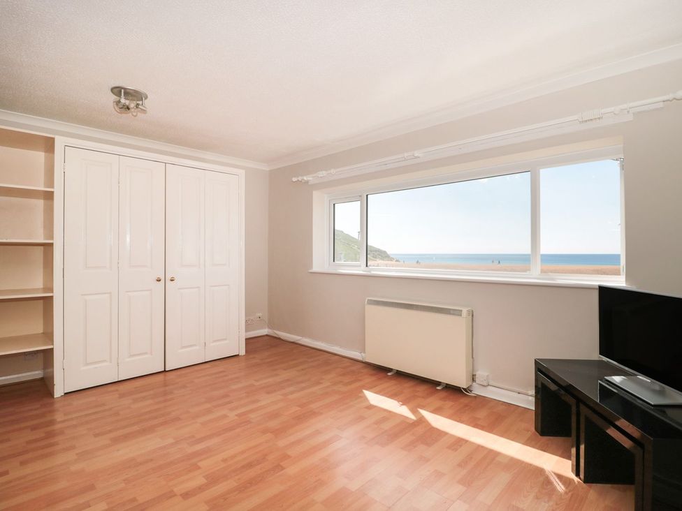A living room with a view of the sea at Flat 30 in Bridport