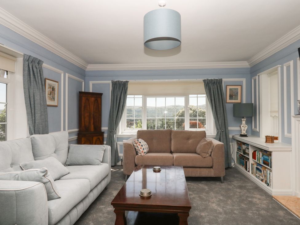 A living room with a sofa and window at The White House in Okehampton