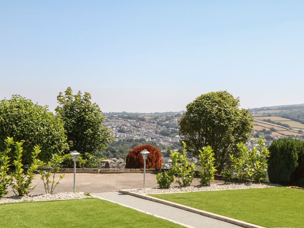 A garden with trees and bushes at The White House in Okehampton