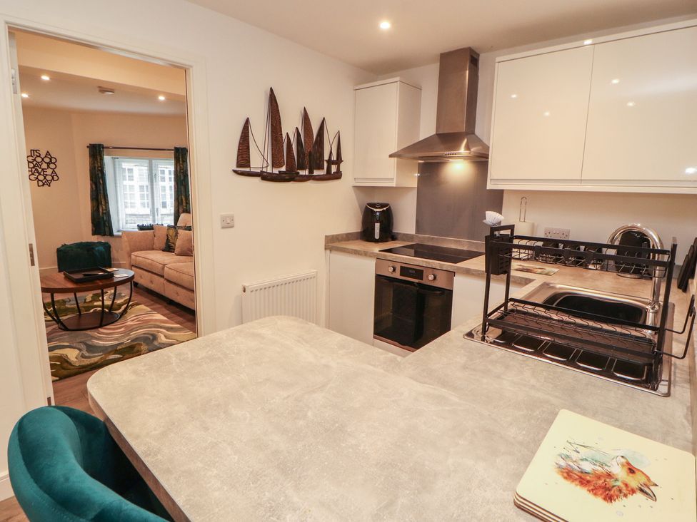 A kitchen with appliances and a counter at Hidden Gem in 