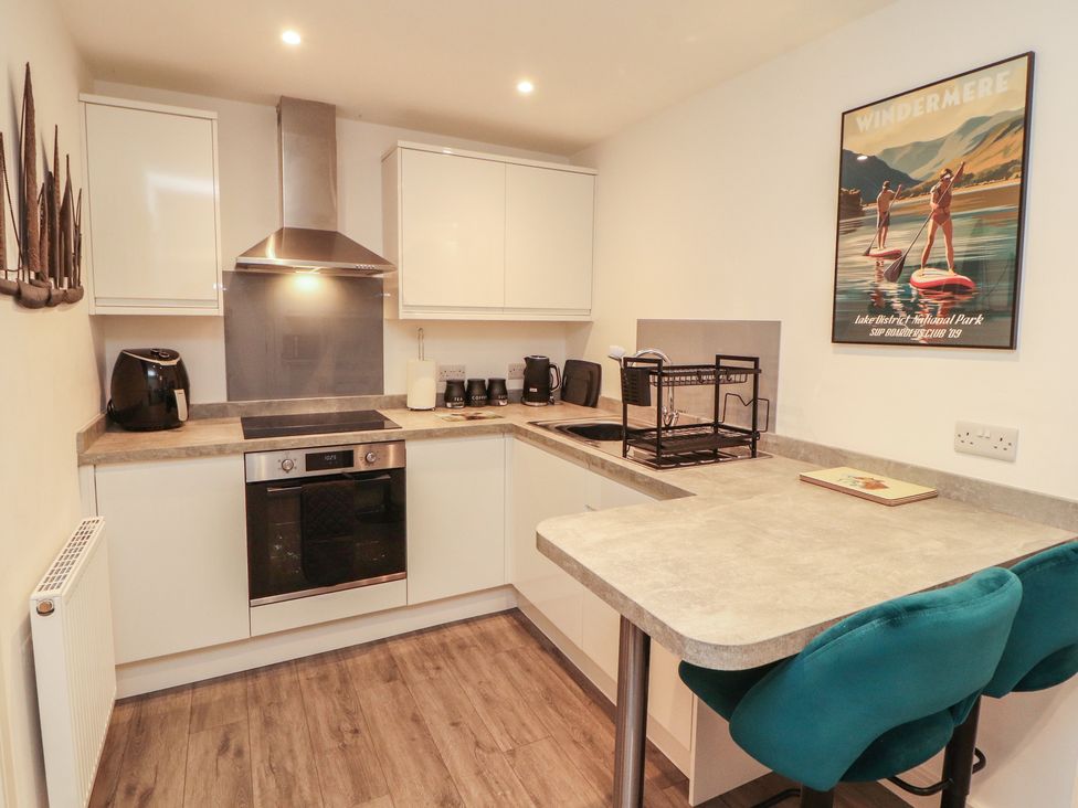 A kitchen with modern fixtures and appliances at Hidden Gem