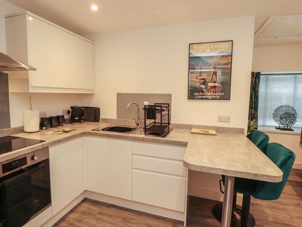A kitchen with sink and appliances at Hidden Gem in 