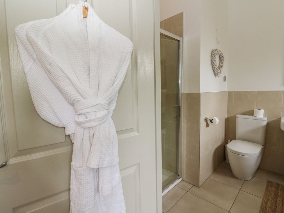 A bathroom with a shower and toilet at Almond in Killin