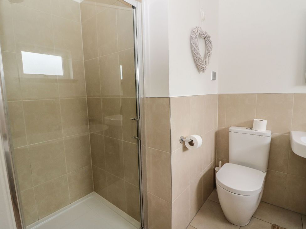A bathroom with a shower and toilet at Garth Cottage in Killin