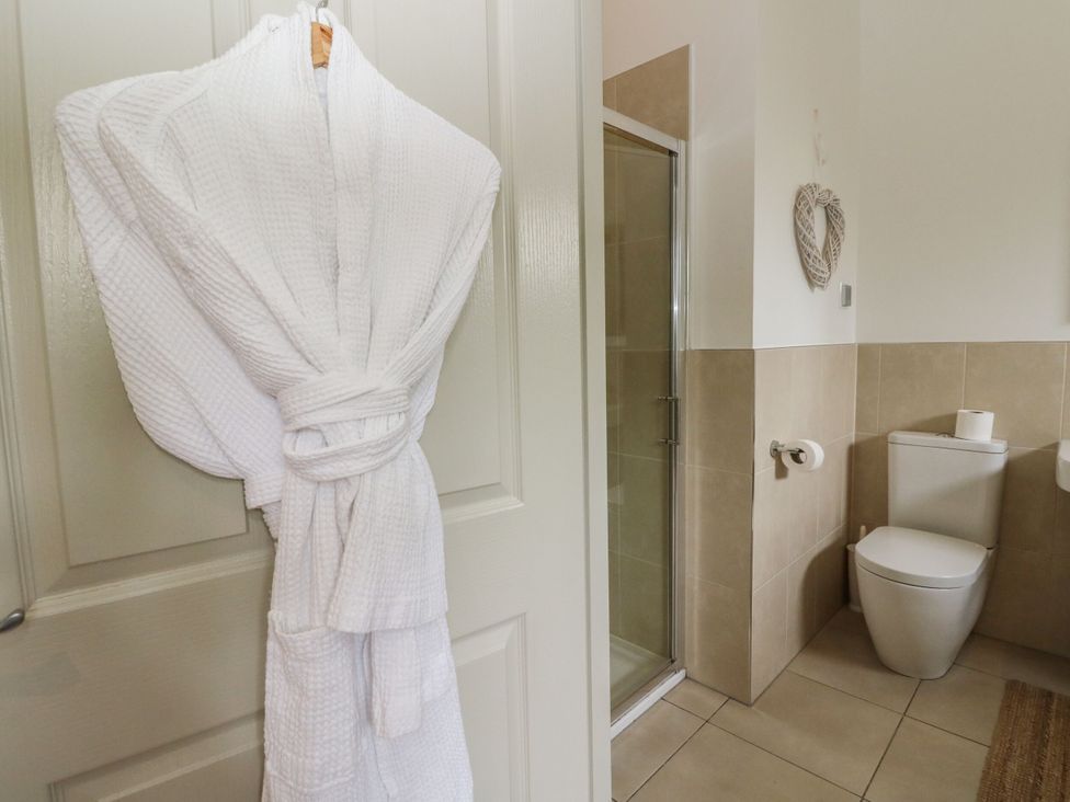 A bathroom with a shower and a toilet at Garth Cottage in Killin