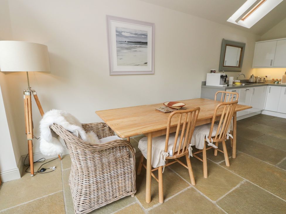 A dining room with a table and chairs at Yew Tree in Killin