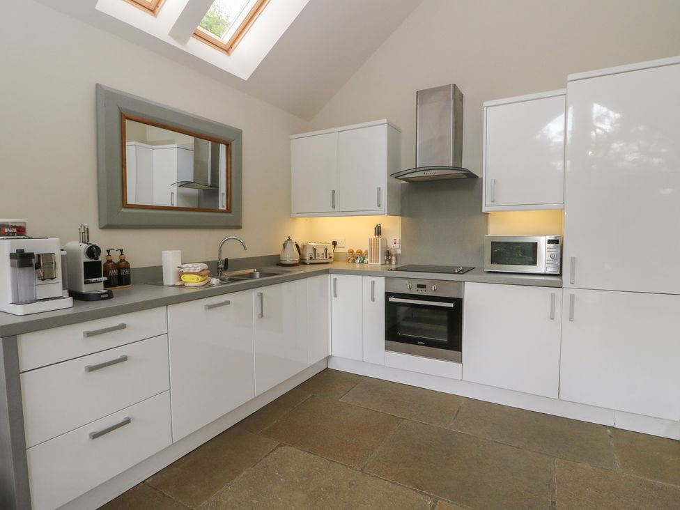 A kitchen with cabinets and appliances at Yew Tree in Killin