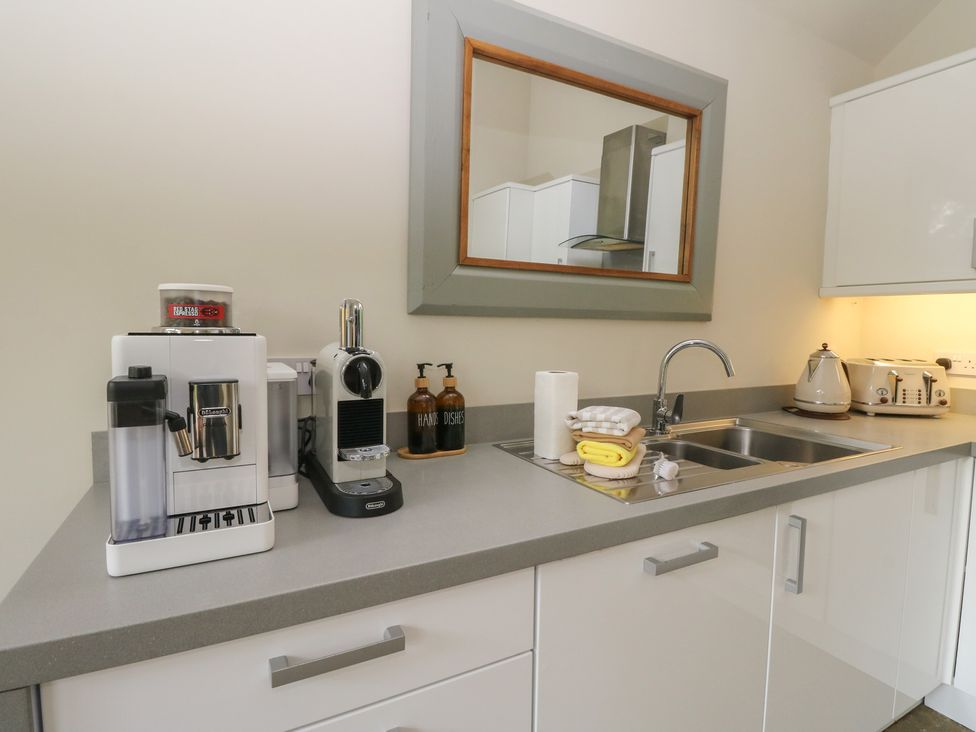 A kitchen with coffee machines and utensils at Yew Tree in Killin