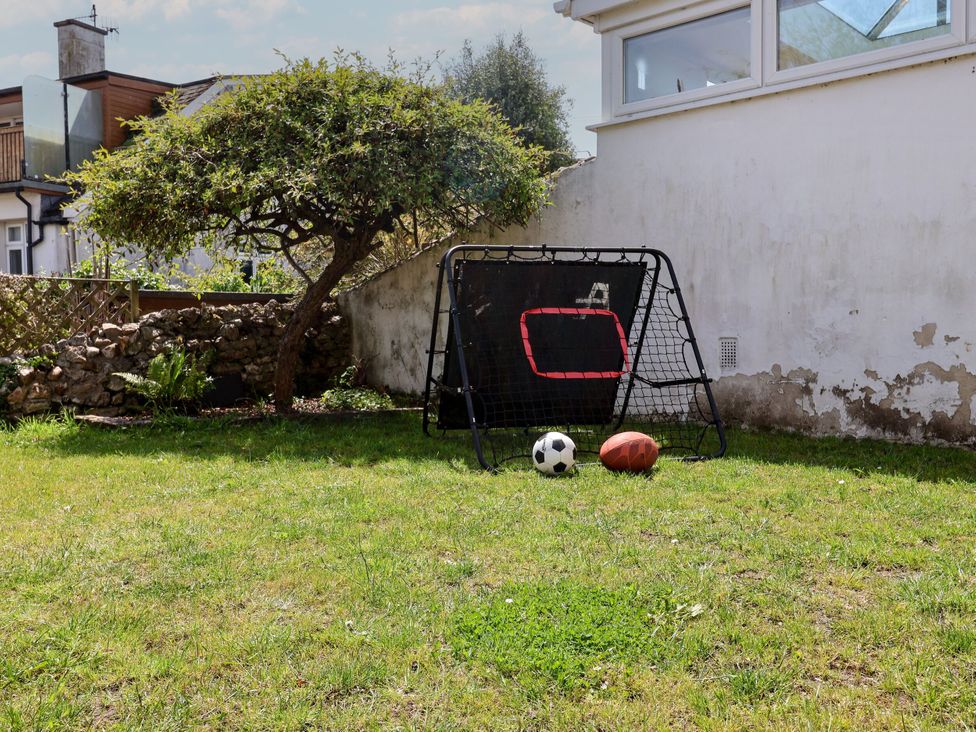 A garden with a goal, soccer ball, and football at Mayflower Cottage in Lyme Regis