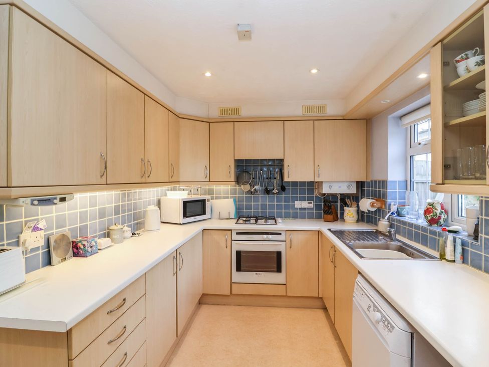 A kitchen with cabinets and appliances at Number 10, Broadway
