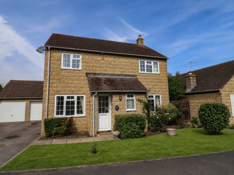 A house with a garage and front garden at Number 10, Broadway
