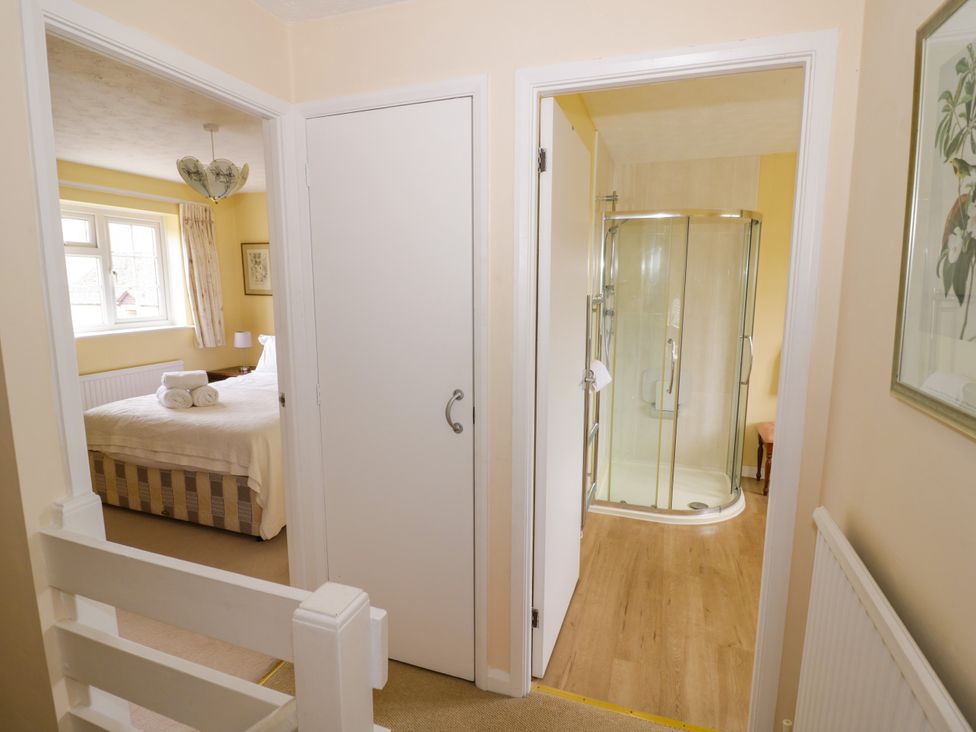 A bathroom with a shower and a view of a bedroom at Number 10, Broadway in Broadway