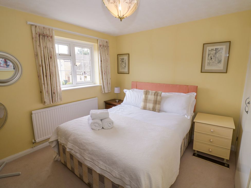 A bedroom with a bed and window at Number 10, Broadway