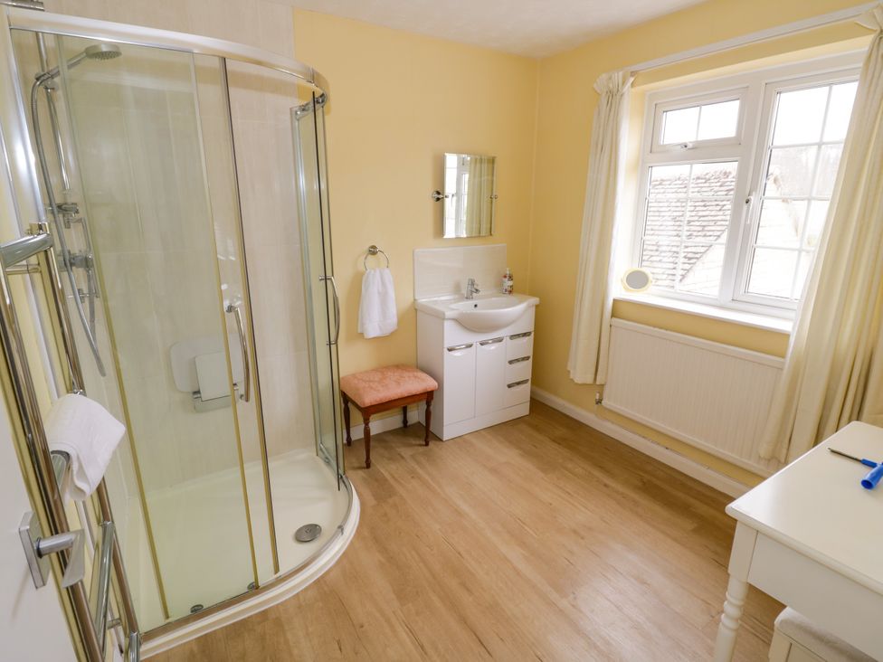 A bathroom with shower and washbasin at Number 10, Broadway