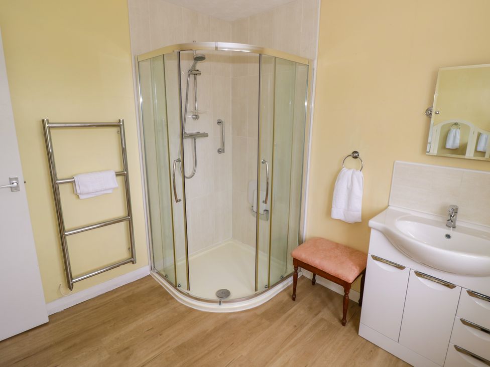 A bathroom featuring a shower and washbasin at Number 10, Broadway