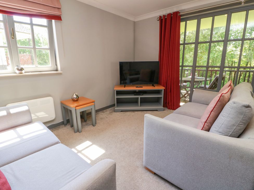 A living room with a television and a sofa at 7 Brunston Avenue 