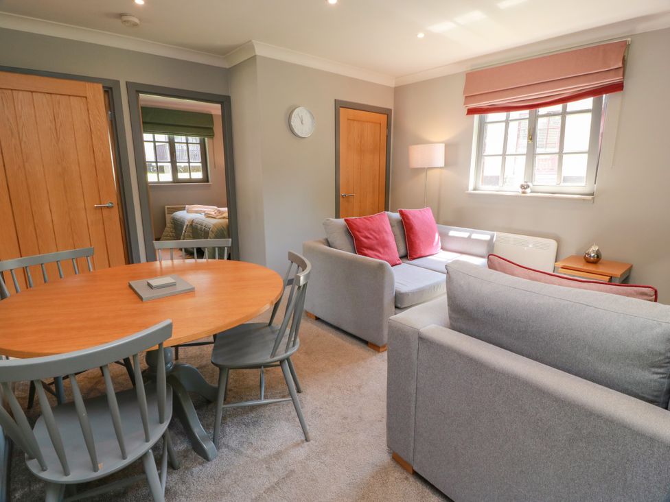 A living room with seating and dining area at 7 Brunston Avenue