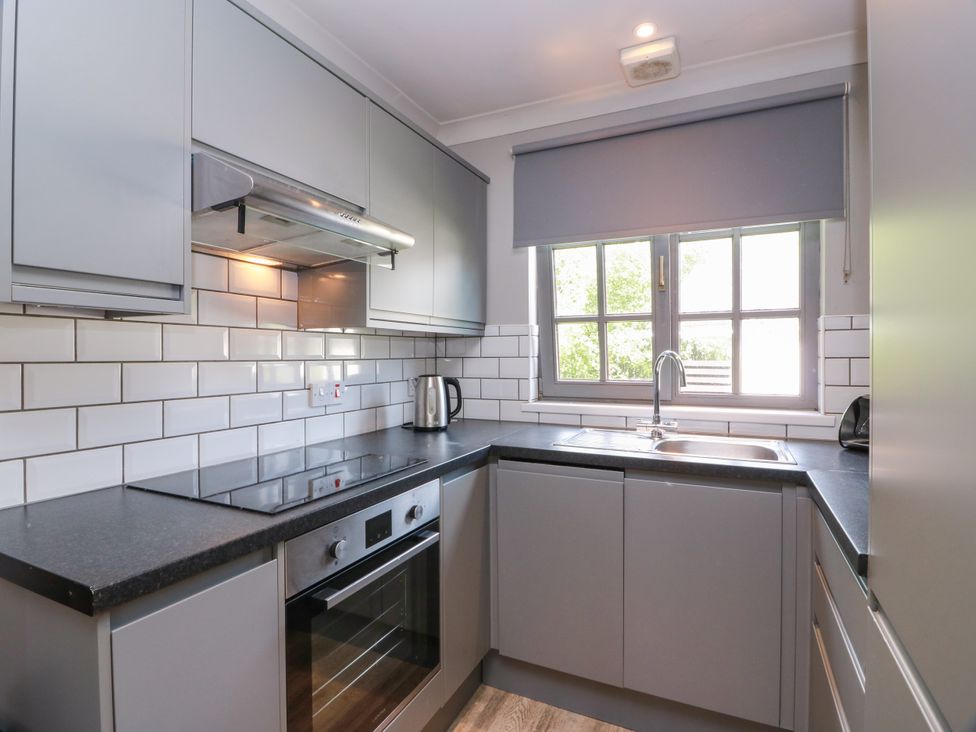 A kitchen with cabinets, sink, and stove at 7 Brunston Avenue in 
