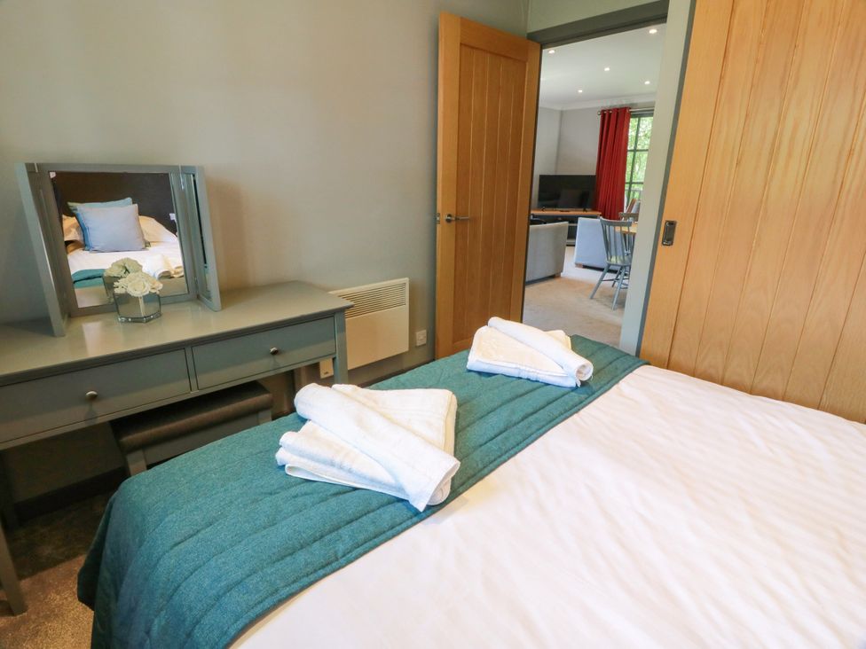 A bedroom with a bed and a mirror at 7 Brunston Avenue