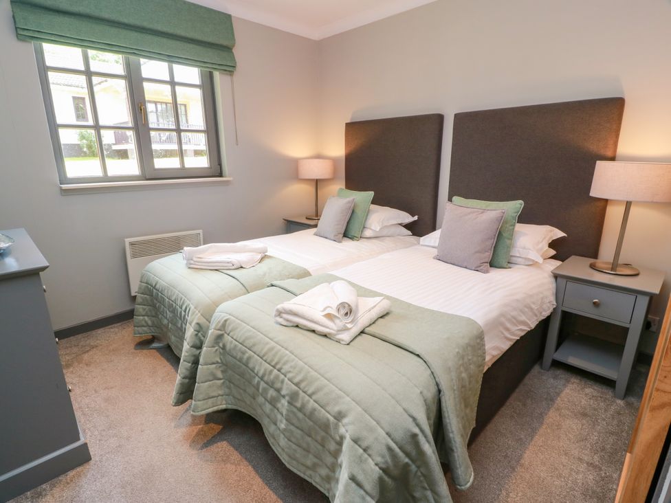 A bedroom with twin beds and a window at 7 Brunston Avenue