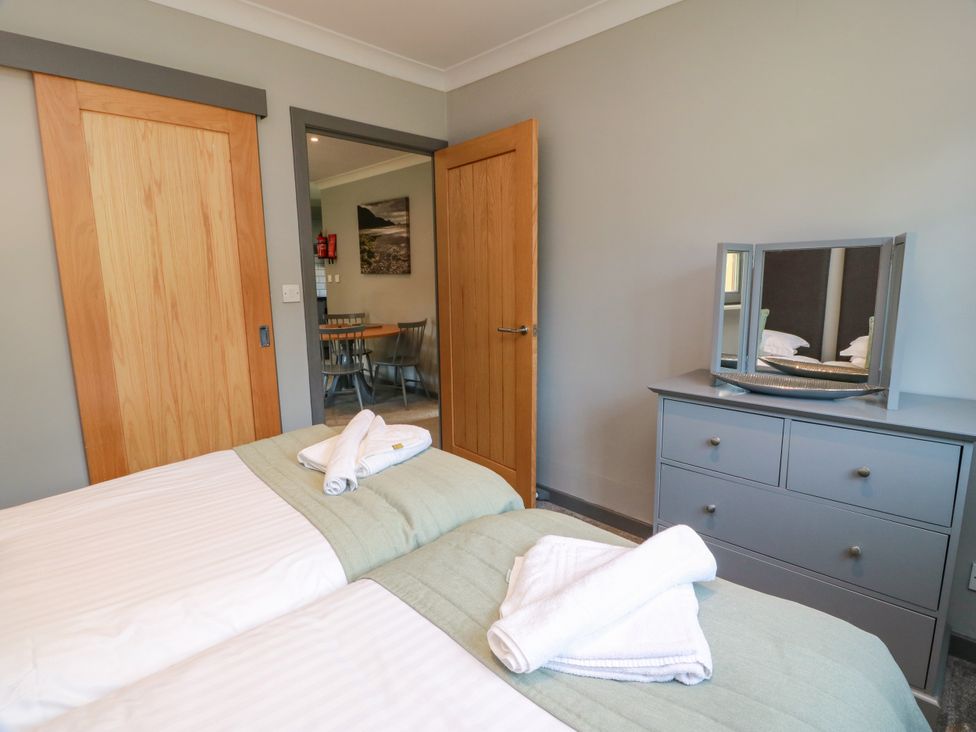 A bedroom with two beds and a dresser at 7 Brunston Avenue