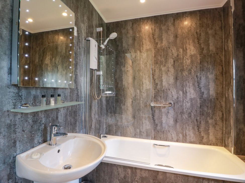 A bathroom with a sink, bathtub, and shower at 7 Brunston Avenue