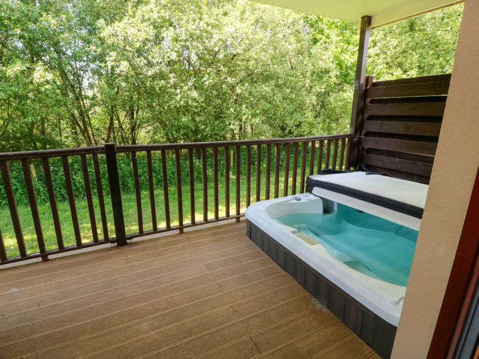 An outdoor deck with a hot tub at 7 Brunston Avenue 