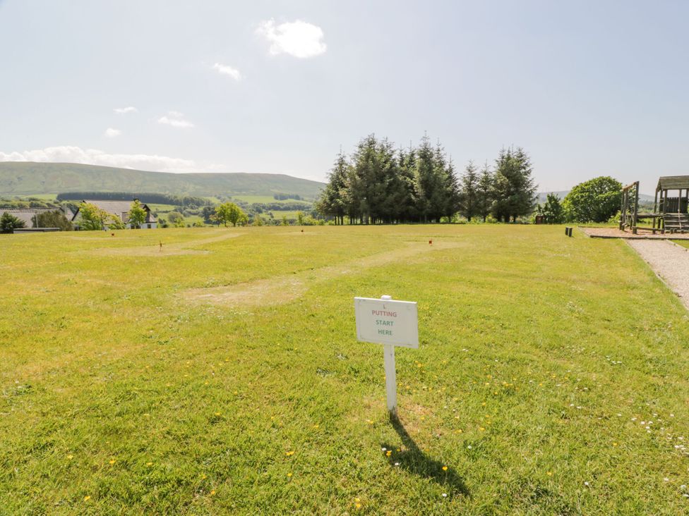 A putting green with a sign indicating start point at 7 Brunston Avenue