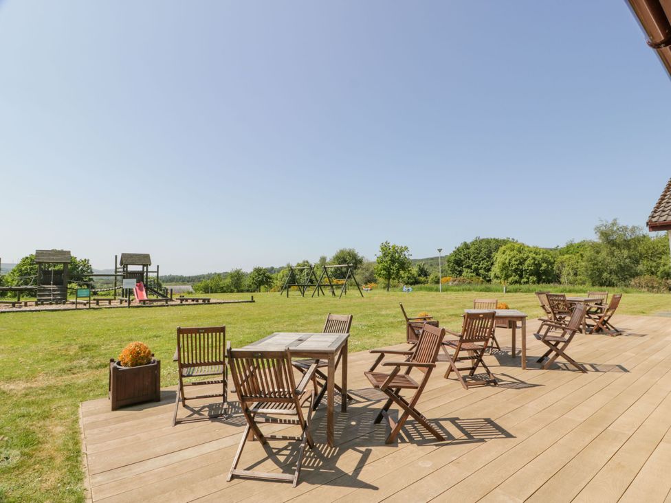 A garden with tables and chairs near a playset at 7 Brunston Avenue
