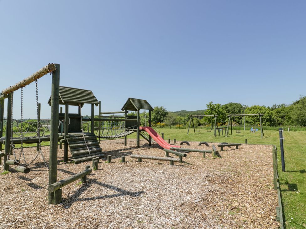 A playground with swings and a slide at 7 Brunston Avenue
