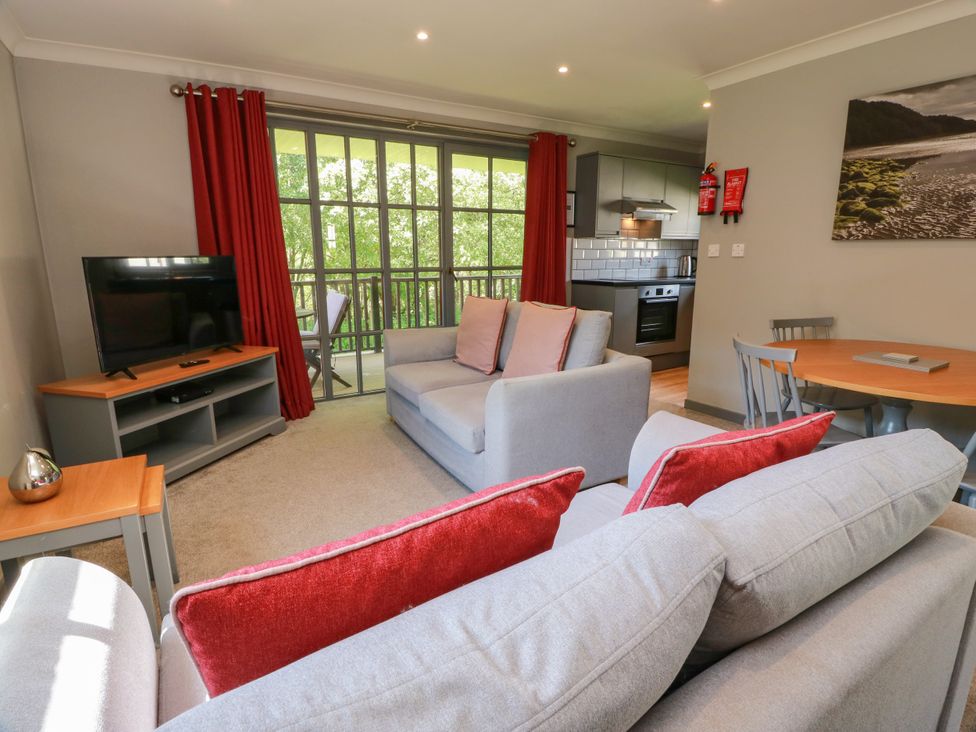A living room with a sofa and a television at 7 Brunston Avenue