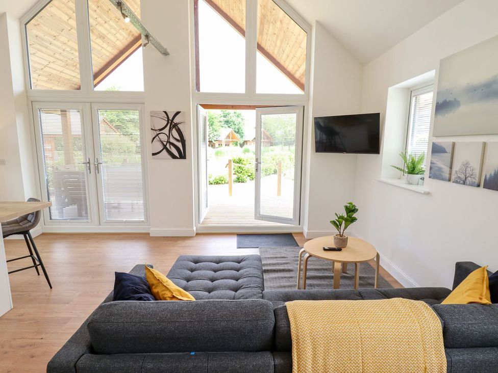 A living room with a sofa and a coffee table at The Lilac Owl in Lincoln
