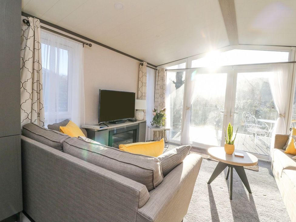 A living room with a sofa and television at Hollybirch in Crieff
