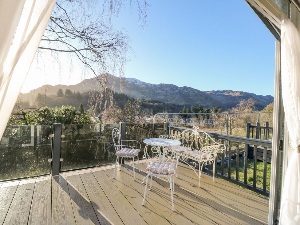 A balcony with patio furniture and mountain view at Hollybirch in Crieff