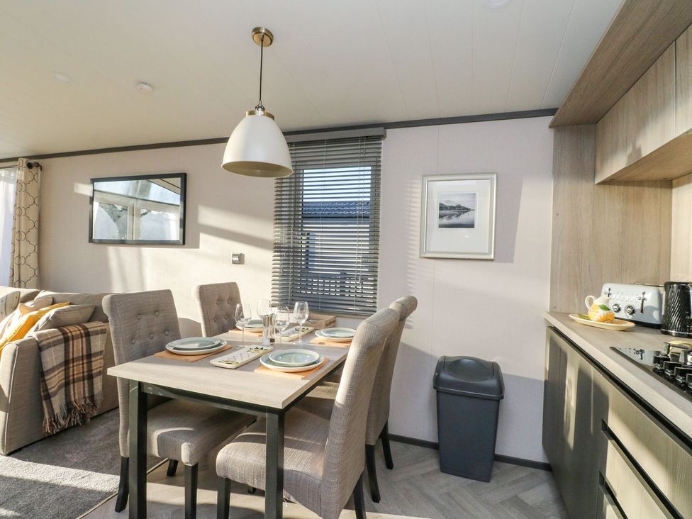 A dining room with a table and chairs at Hollybirch in Crieff