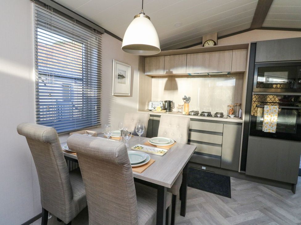 A dining room with a table and chairs at Hollybirch in Crieff