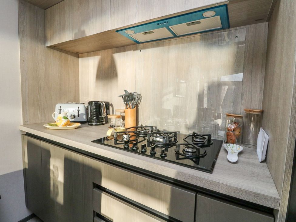 A kitchen with gas stove and appliances at Hollybirch in Crieff