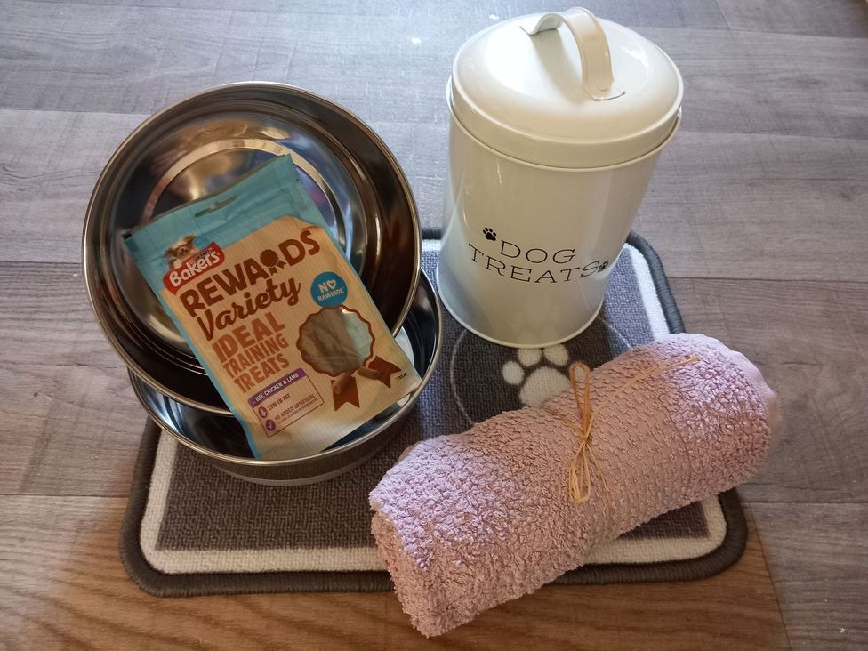 Dog bowls, treats, towel, and mat at Hollybirch in Crieff