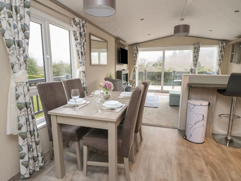 A dining room with a table and chairs at Rowan in Crieff