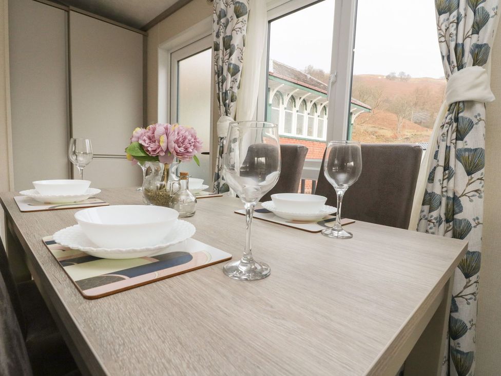 A dining room with a table set for meals at Rowan in Crieff