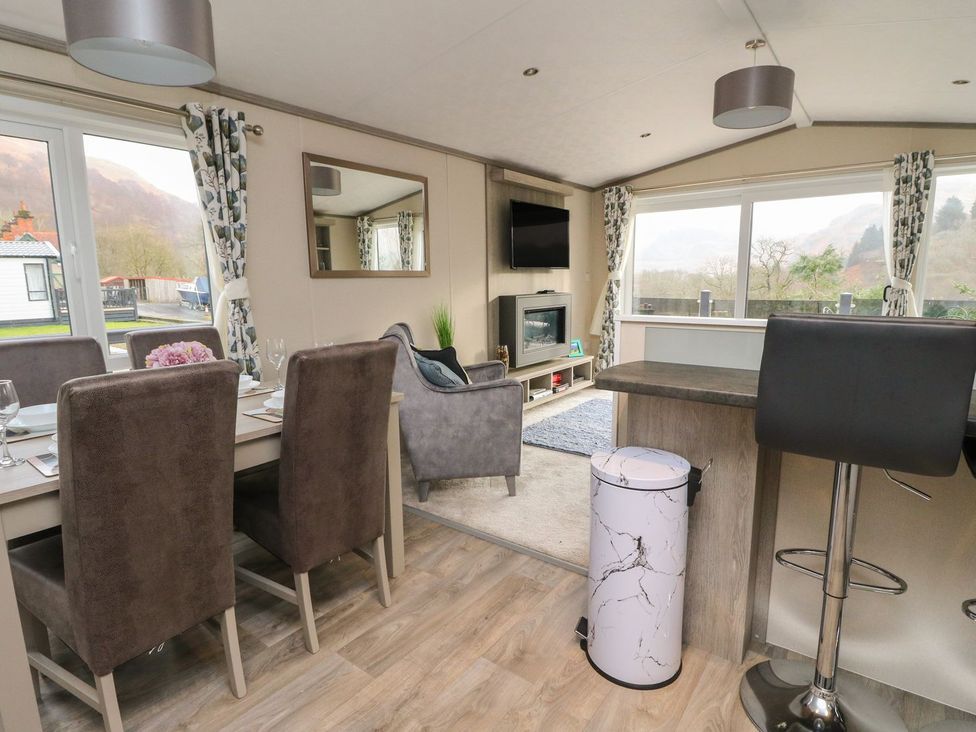 A dining room with a table and chairs at Rowan in Crieff