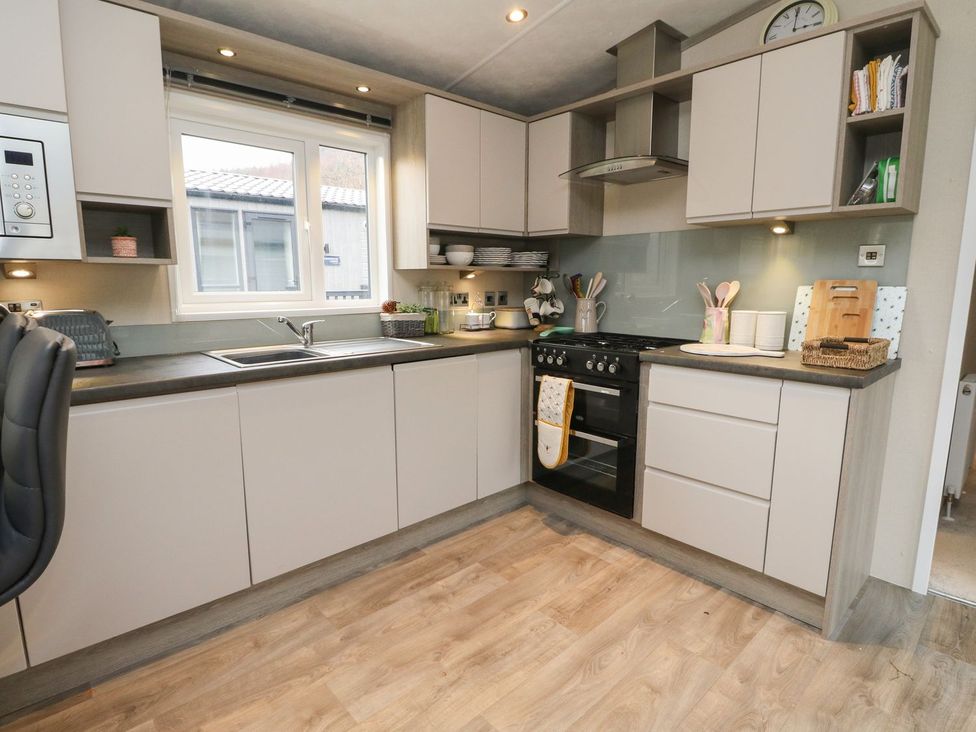 A kitchen with cabinets and appliances at Rowan in Crieff