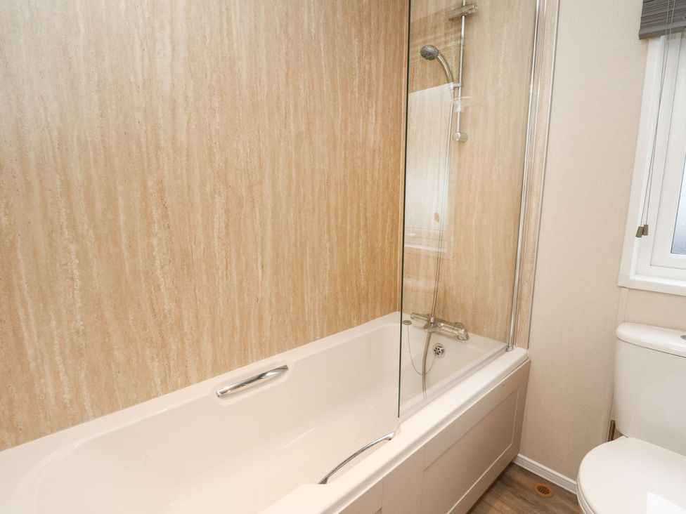 A bathroom with a bathtub and shower at Rowan in Crieff