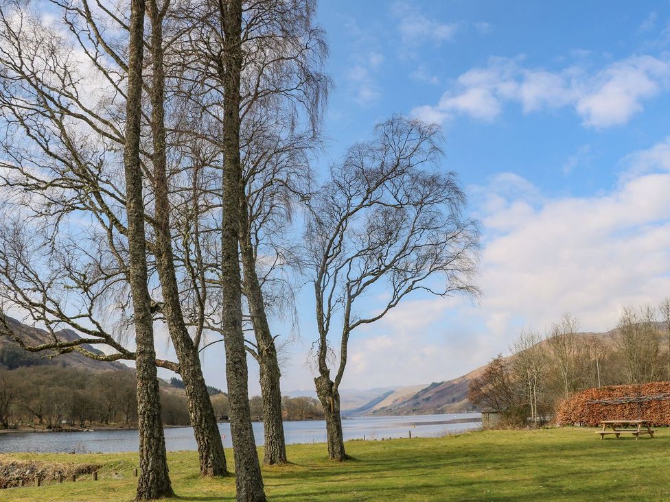 A scenic view of trees by a lake at Rowan in Crieff