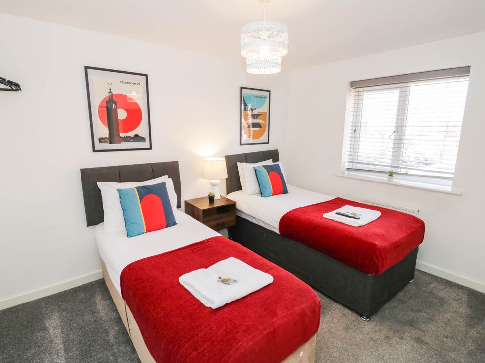 A bedroom with two single beds at 5 Warrington Lane in Coventry