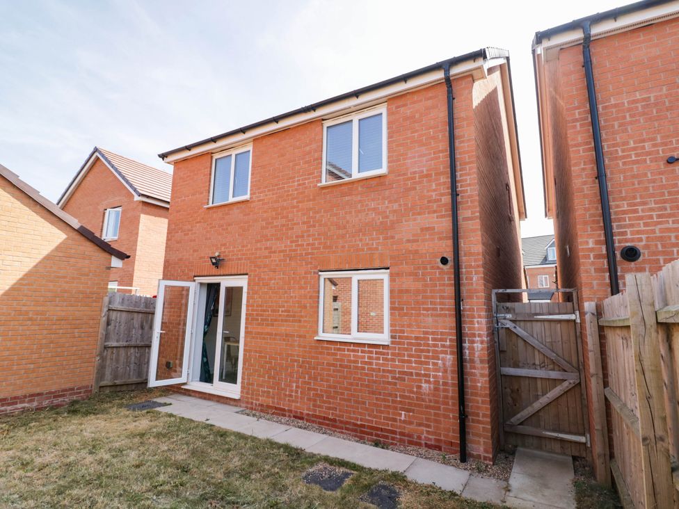 A house with a garden and patio area at 5 Warrington Lane Coventry
