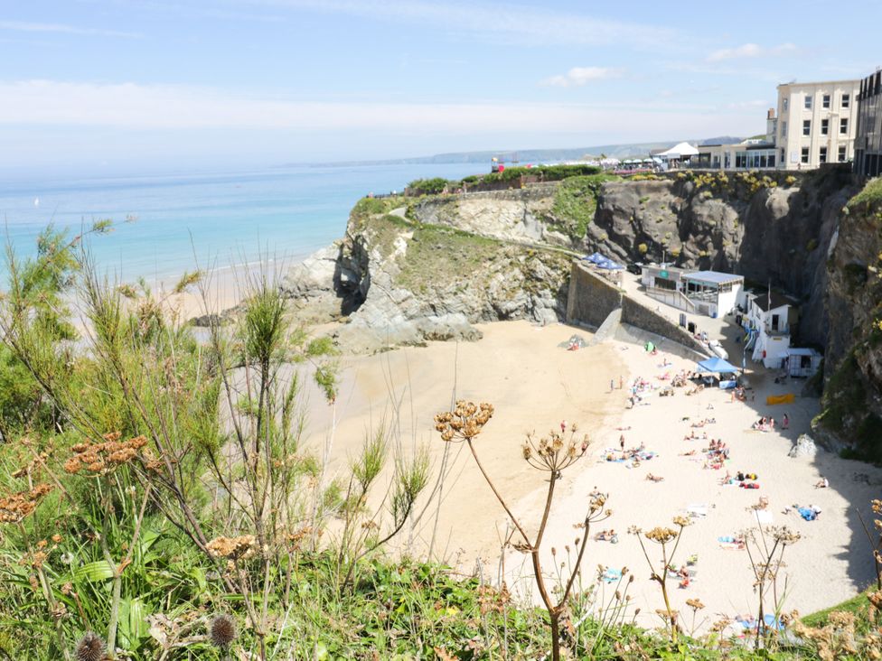 A beach with sand and people at Two Bed Apartment No.4 in Newquay