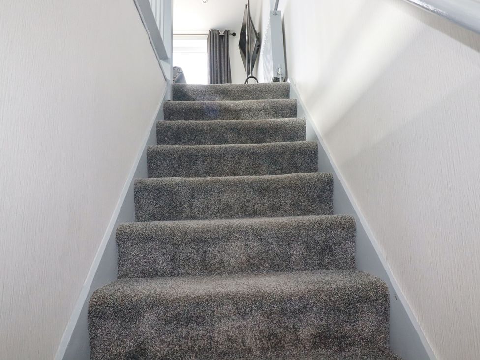 A staircase with carpet and wall at Penthouse No.3 in Newquay